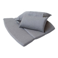 Soft gray cushions and pillows in various shapes, featuring a minimalist design and textured fabric. Perfect for modern decor.