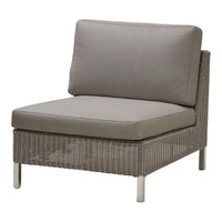 Gray cushioned lounge chair with woven textured base, perfect for modern outdoor settings.