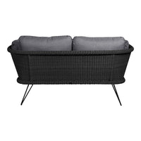 Gray woven sofa with sleek black legs and plush gray cushions, perfect for modern outdoor decor.