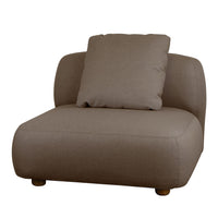 Modern brown upholstered accent chair with a smooth, minimalist design and a plush matching throw pillow.