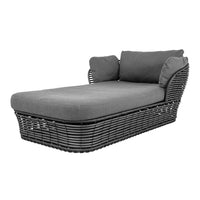 Gray wicker chaise lounge with soft gray cushions, featuring a textured woven pattern for stylish outdoor seating.