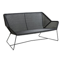 Stylish black woven loveseat with a modern geometric design and sleek metal legs, perfect for contemporary decor.
