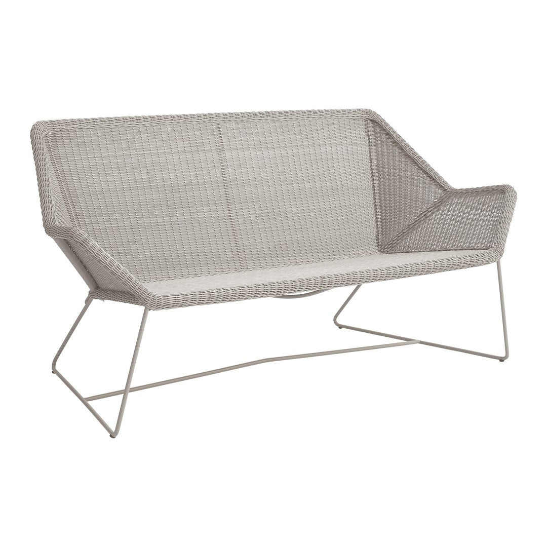 Gray wicker loveseat with a modern geometric pattern and sleek metal legs, perfect for contemporary outdoor settings.