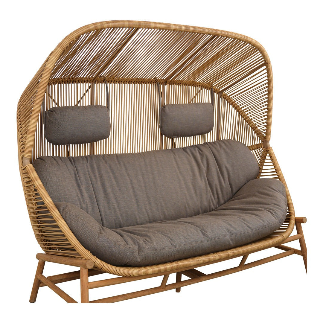 Natural rattan swing sofa with a light brown frame and soft gray cushions, featuring modern, curved lines.