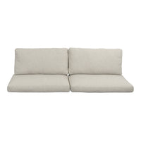 Light beige sofa with textured fabric and minimalistic design, perfect for modern living spaces.
