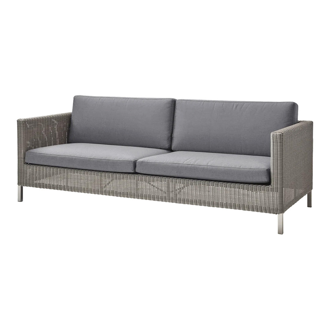 Gray cushioned sofa with a textured wicker frame and sleek metal legs, perfect for modern outdoor spaces.
