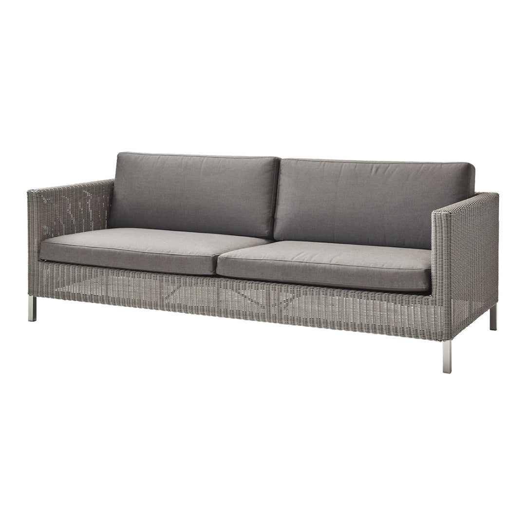 Gray outdoor sofa with a textured woven pattern and comfortable cushions in muted tones. Modern, sleek design.