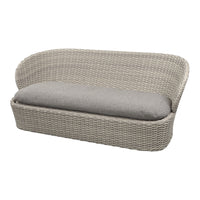 Light gray woven outdoor sofa with a plush gray cushion, featuring a sleek, contemporary design.