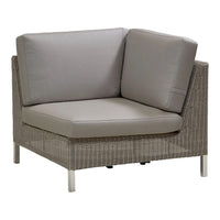 Gray outdoor sectional chair with sleek, textured fabric and a modern wicker design, perfect for relaxing spaces.