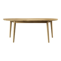 Oval wooden table in natural oak finish with smooth surface and light-colored legs. Perfect for modern dining spaces.