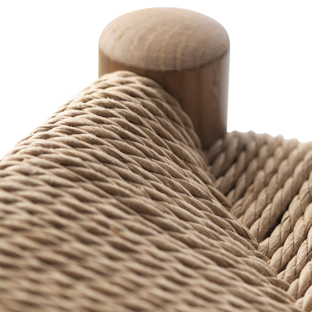 Natural beige woven texture with a smooth wooden detail, showcasing earthy tones and organic patterns.