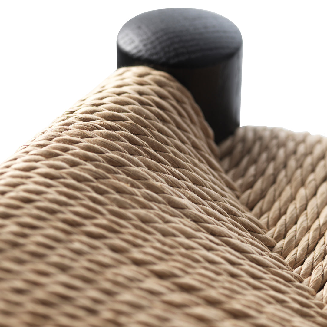 Natural woven texture in beige with a sleek black accent. Perfect blend of organic and modern design elements.
