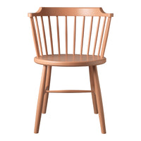 "Peach-colored wooden chair with vertical slats and a round seat, showcasing a minimalist design."