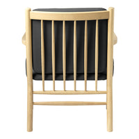 Black cushioned chair with a natural wood frame and vertical slat back design. Minimalist and modern aesthetic.