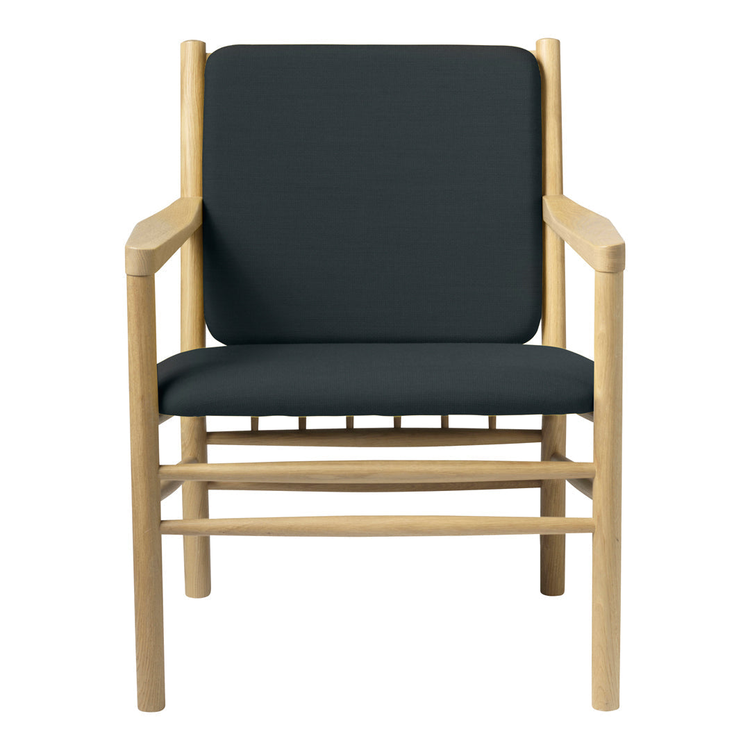 Black upholstered chair with light wood frame, minimalist design, and clean lines for modern decor.