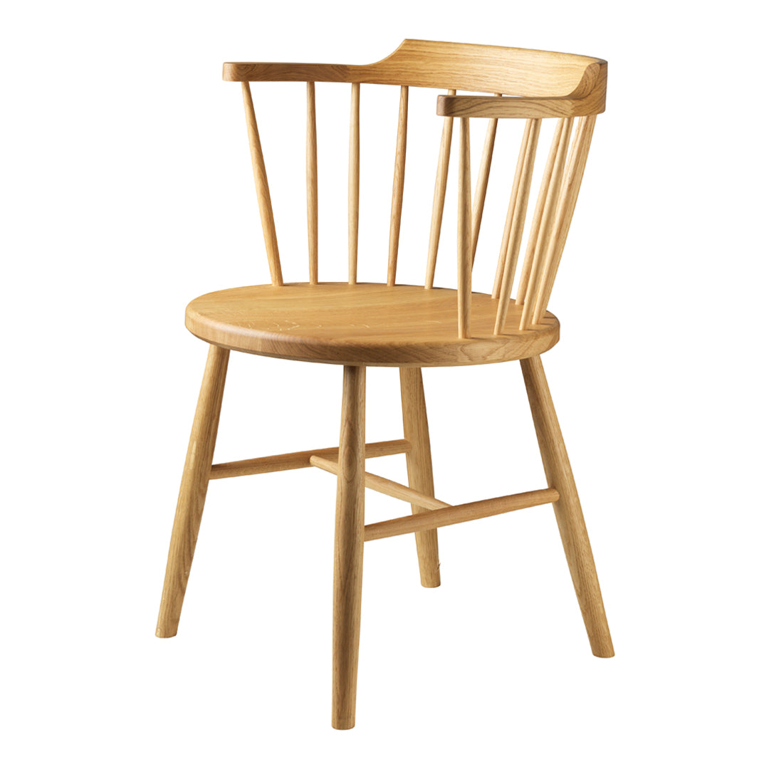 Natural wood dining chair with a light finish and simple, minimalist design featuring vertical slats.