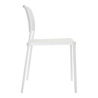 Side view of a white, textured chair with a modern, sleek design and perforated backrest pattern.