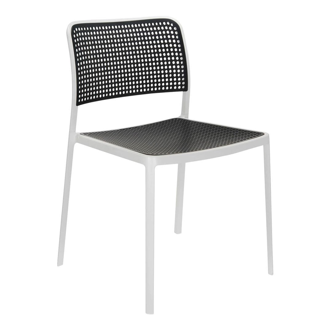 Modern black and white chair featuring a perforated backrest and seat for a stylish, airy look. Perfect for any decor.