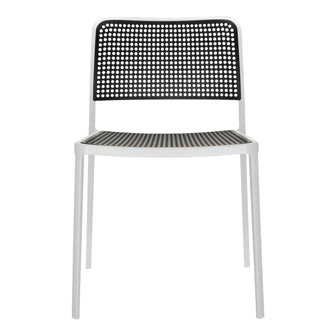 Black and white perforated chair with a geometric pattern and sleek modern design, perfect for indoor or outdoor use.