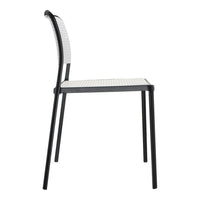 Black chair with a textured white seat and backrest, featuring a sleek, modern design and minimalist pattern.