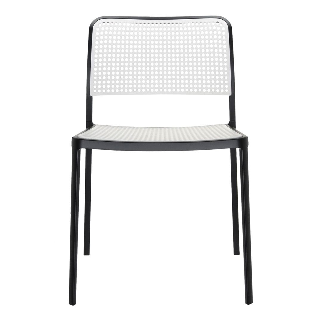 Black metal chair with a white perforated backrest and seat, featuring a modern minimalist design.
