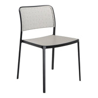 Gray perforated metal chair with a sleek black frame, featuring a modern minimalist design. Ideal for contemporary spaces.