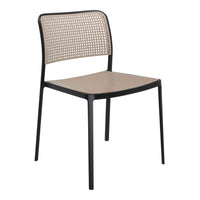 Modern black chair with a beige perforated pattern on the seat and backrest, enhancing style and comfort.