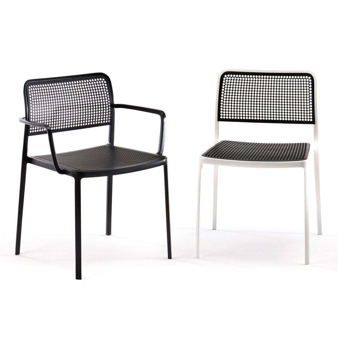 Black and white modern chairs with grid-patterned backs and seats, showcasing a sleek, minimalist design.