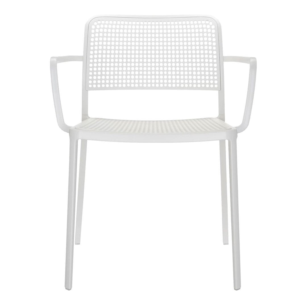 White perforated plastic chair with clean lines and minimalistic design, featuring a simple geometric pattern.