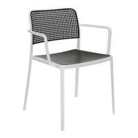 Black and white perforated chair with a sleek design and minimalist appeal, perfect for modern decor.
