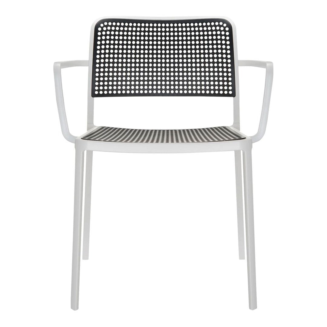 Black and white patterned chair with a sleek modern design and lightweight white metal frame.