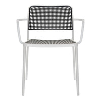 Black and white patterned chair with a sleek modern design and lightweight white metal frame.