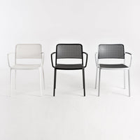Set of three stylish chairs in white, black, and gray with a modern mesh pattern and sleek metal frames.