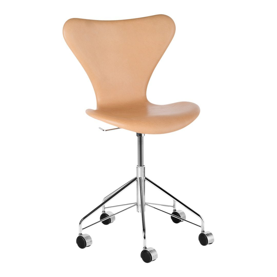 Light beige swivel chair with a smooth, contoured seat and a chrome base, perfect for modern office decor.