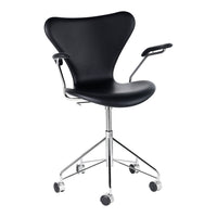 Black ergonomic chair with a sleek, curved design and chrome accents, featuring a minimalist aesthetic and smooth wheels.