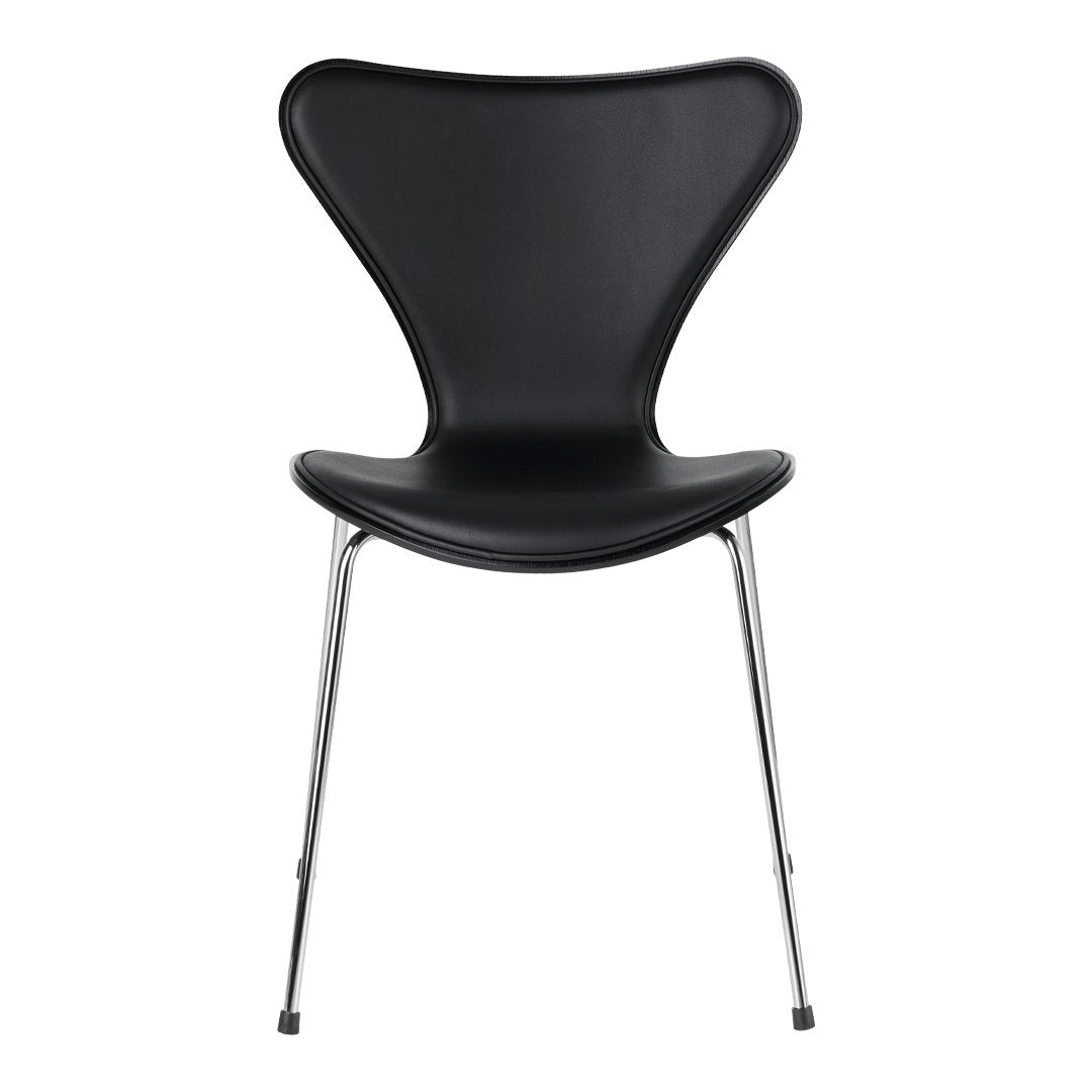 Black chair with a sleek, curved design and chrome legs, featuring a smooth, modern finish. Perfect for contemporary spaces.