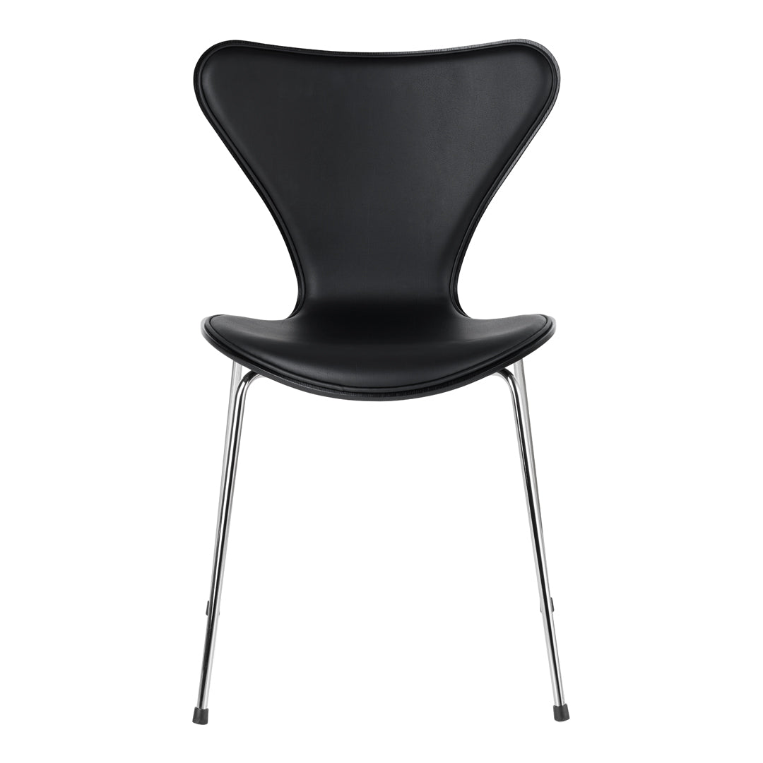 Black molded chair with a sleek, glossy finish and chrome legs, showcasing a modern, minimalist design.