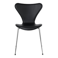 Black molded chair with a sleek, glossy finish and chrome legs, showcasing a modern, minimalist design.