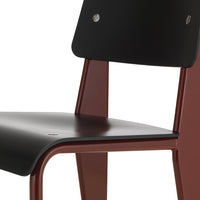 Black wood contrasting with rich burgundy frame, featuring smooth, modern design with minimalistic aesthetic.