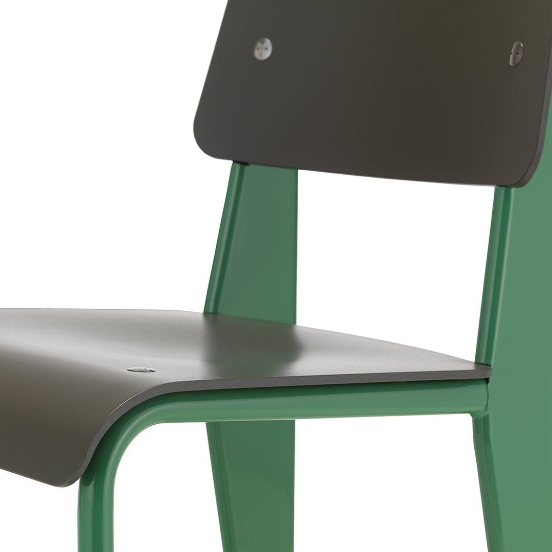 Green and dark gray modern chair with sleek lines and a minimalist design, perfect for contemporary spaces.