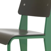 Green and dark gray modern chair with sleek lines and a minimalist design, perfect for contemporary spaces.