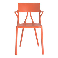 "Vibrant orange chair with modern design and smooth finish, featuring unique cut-out armrests."