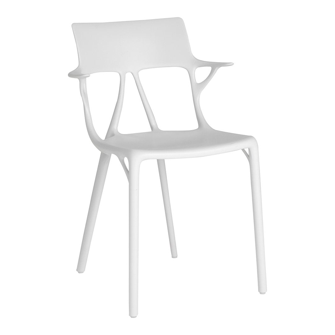 White modern chair with a sleek, minimalist design and smooth, glossy finish. Ideal for contemporary decor.