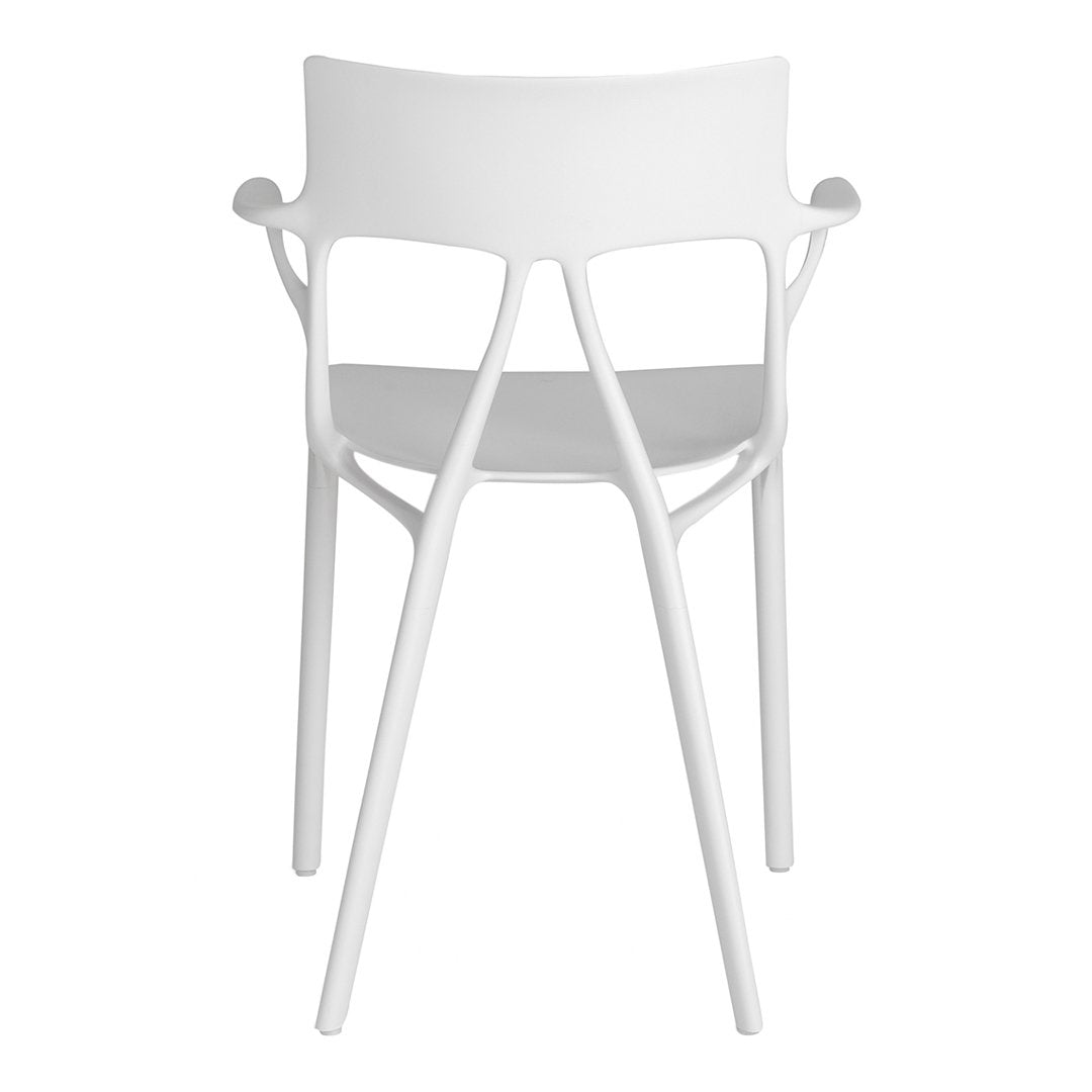 White modern chair with a sleek design and minimalistic pattern. Perfect for contemporary decor.