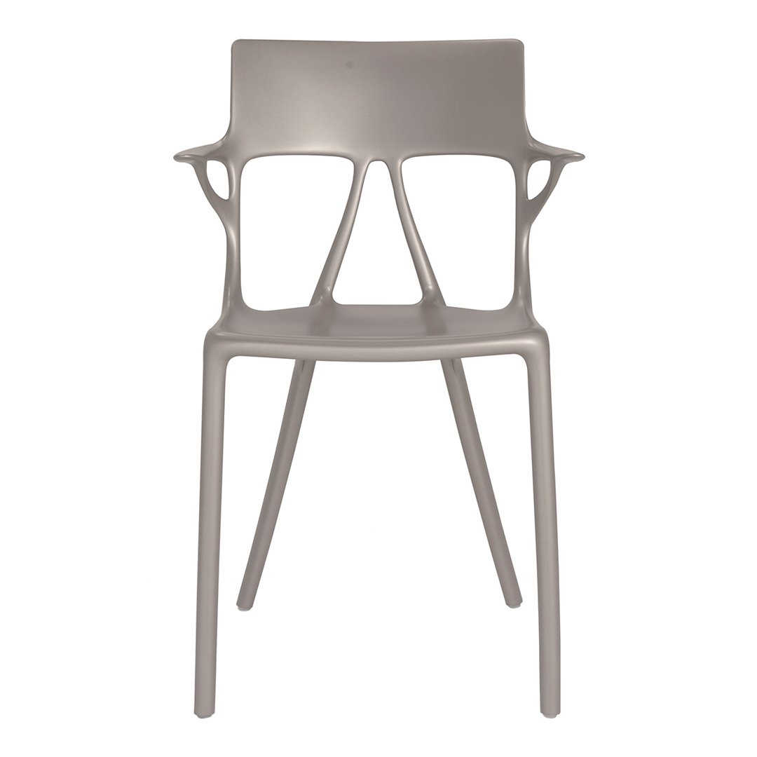 Gray modern chair with a sleek, minimalist design and unique cut-out patterns on the backrest and arms.