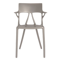 Gray modern chair with a sleek, minimalist design and unique cut-out patterns on the backrest and arms.