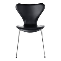 Black chair with a unique butterfly shape and sleek chrome legs, showcasing a modern and minimalist design.