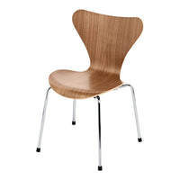 Light wood finish with a smooth, curved silhouette and chrome legs, creating a modern, minimalistic design.