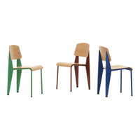 Colorful modern chairs: green, brown, and blue metal frames with light wood seats, featuring a sleek, minimalist design.