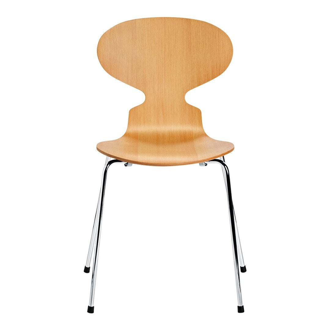Natural wood chair with a smooth finish and sleek chrome legs, featuring a minimalist design and organic curves.